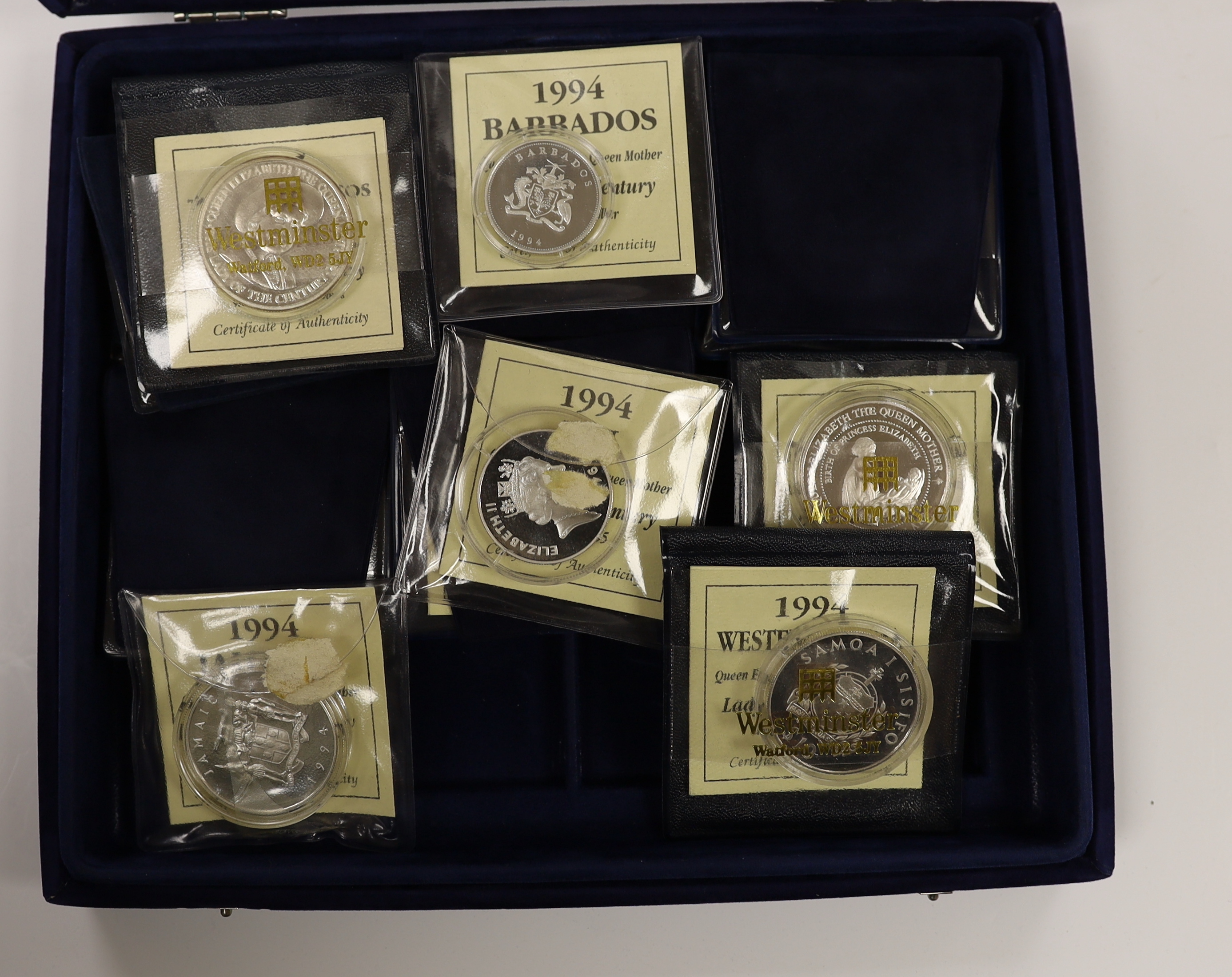 A collection of Royal Mint, Westminster mint and MDM QEII Commonwealth proof silver Royal family commemorative coins, and nine cased Royal Mint silver proof c.1992-95, in four large cases